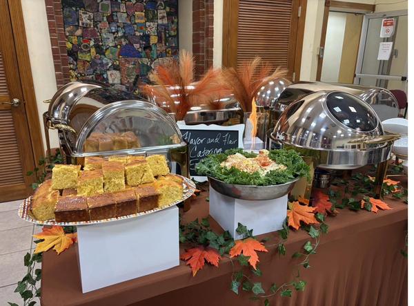 Flavor and Flair Catering holiday catering outdoor spread with chafing dishes and seasonal decor