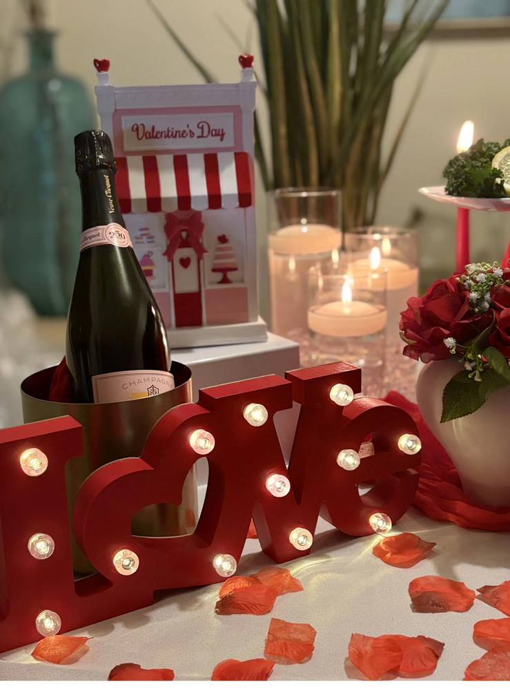 Flavor and Flair Catering romantic table with Veuve Clicquot champagne and lighted LOVE sign
